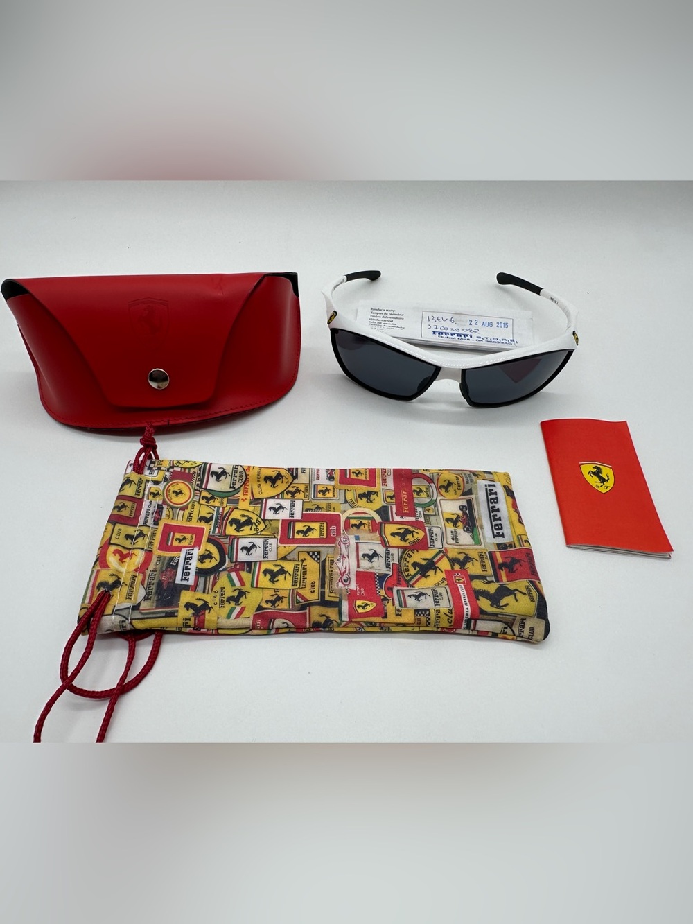 Ferrari White Frame Sunglasses with Red Case and Yellow Logo Pouch